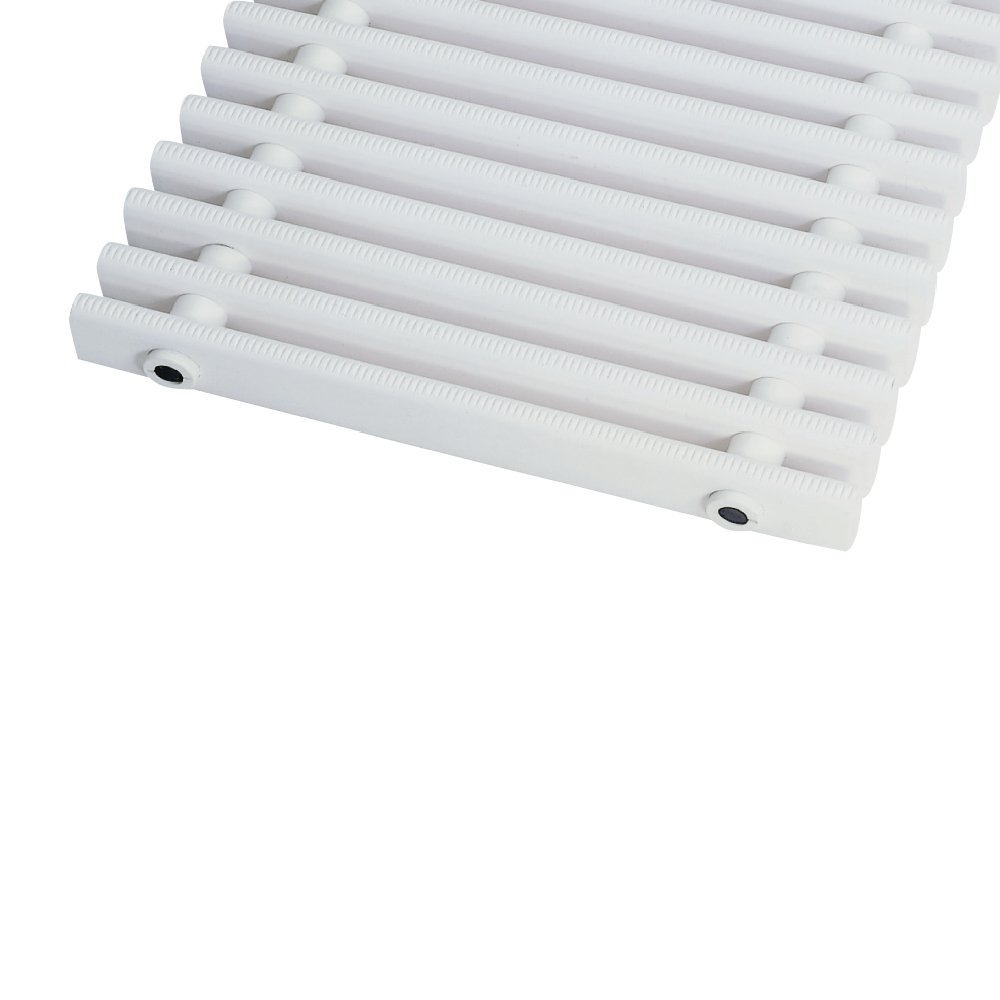 Swimming pool grate running across to the pool edge, bar tops with safety profile embossing, rounded surface, rollable