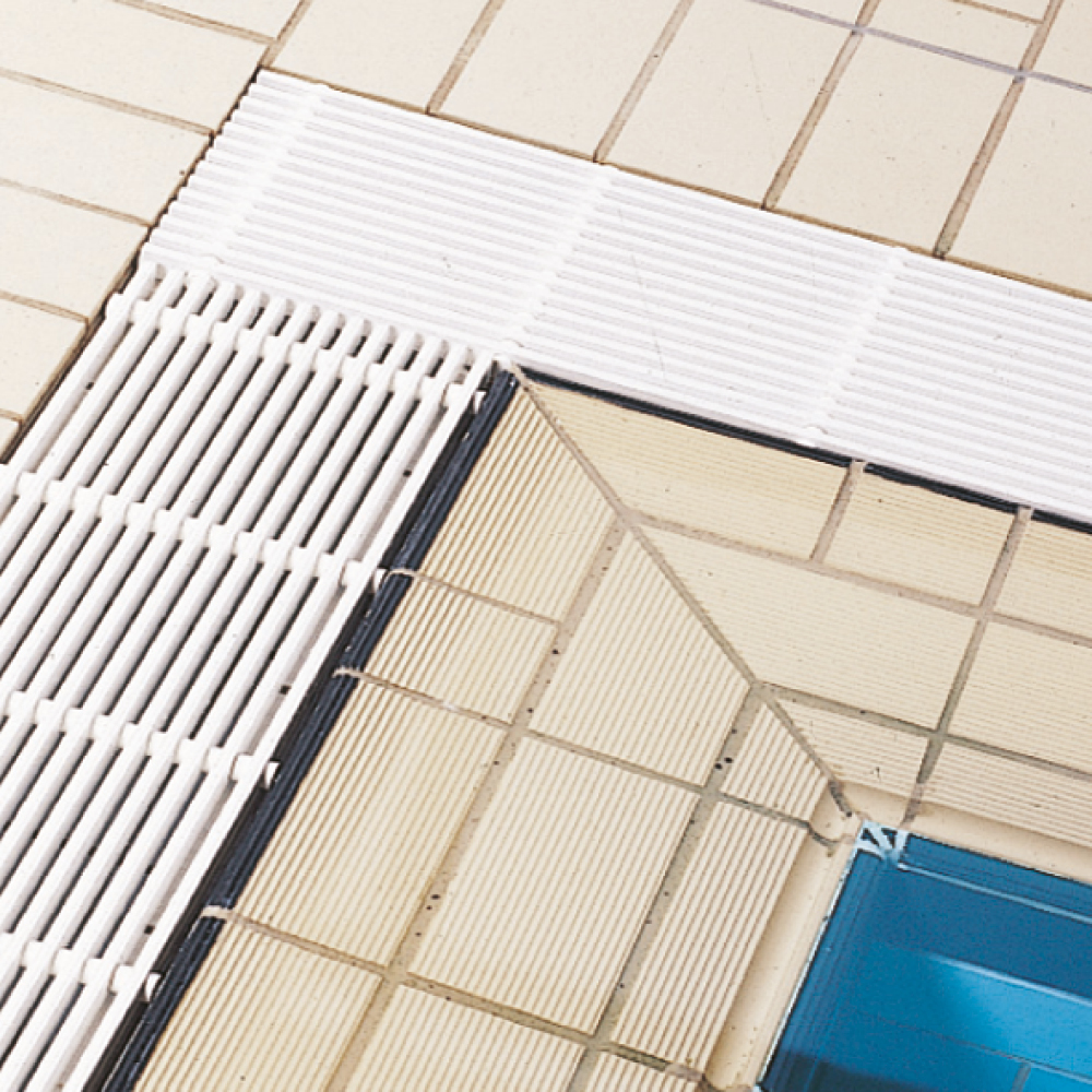 Swimming pool grate, longitudinal to the pool edge, bar top sides with safety profile embossing, rounded surface
